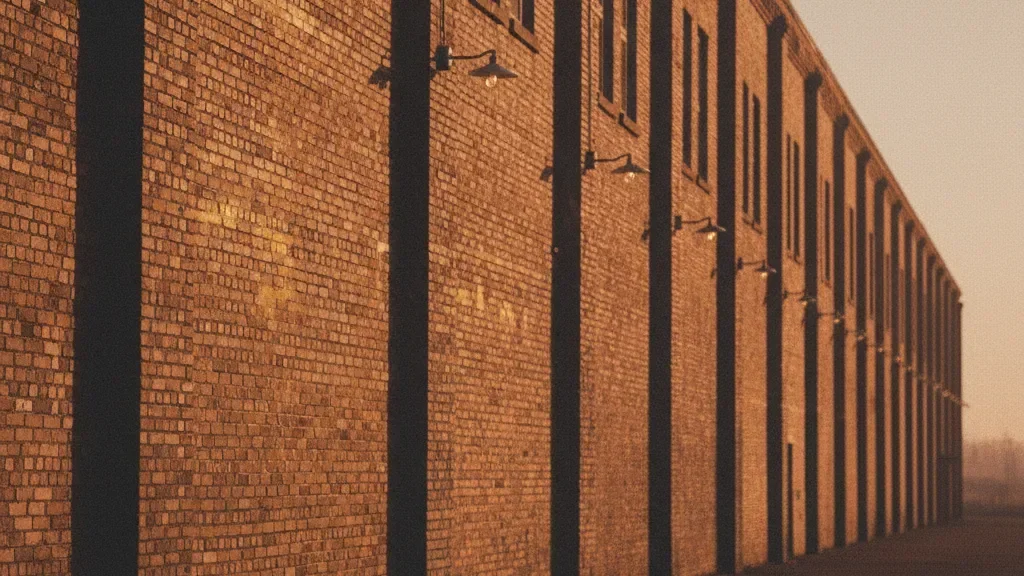 Commercial brick facade with dramatic side lighting